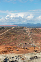 Bottom of surface mining and machinery in an open pit mine