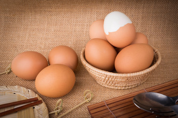 Set Eggs in a basket on  gunny (sackcloth)  background