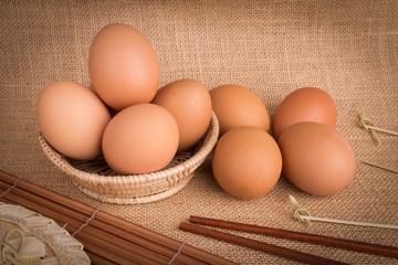 Set Eggs in a basket on  gunny (sackcloth)  background
