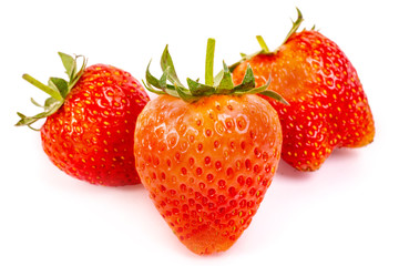 Strawberry with sliced half and leaves isolated on white background with clipping path