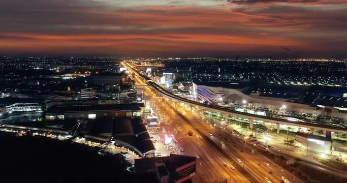 Aerial view move forward on road traffic in city at night.
