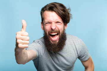 thumb up. good job. like and approval concept. enthusiastic motivated overexcited bearded man...