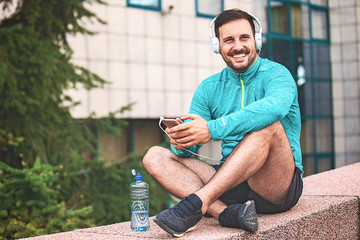 Man is relaxing after jogging