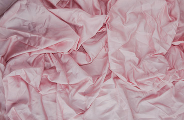 
Pink background. Dented fabric. Fashion