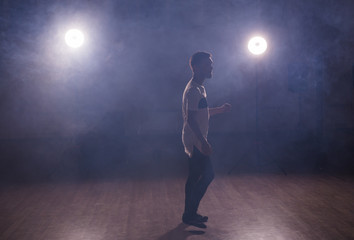 Man dancing latin dance Bachata, merengue, salsa in dance class