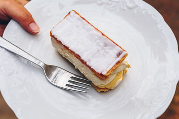 Close up of mille-feuille napoleon pastry on white plate