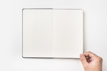 Top view of man's hand hold black notebook
