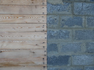 Wall of building blocks and wooden boards