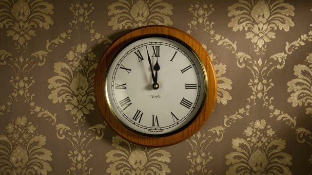 Time lapse clock - camera rotates with big hand of a wooden living room clock from 00:00-01:00