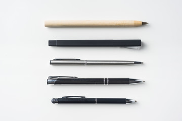 collection of pens on white background