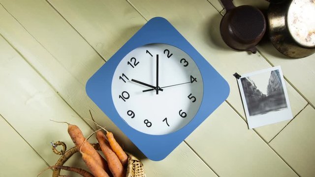 Time lapse clock - camera rotates with big hand of a clock from 11:00-12:00