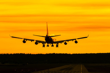 Fototapeta na wymiar Airplane - Jambojet - landing at sunset 