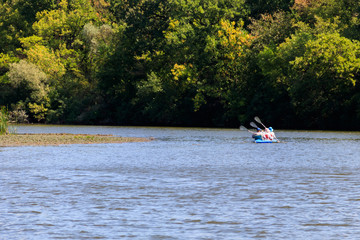 Fototapeta na wymiar Kayaking on the beautiful river at summer