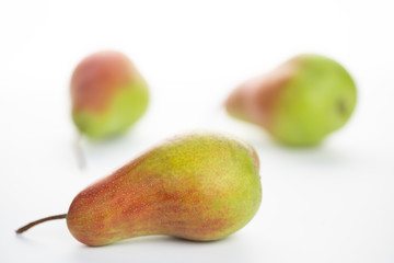 green ripe pear on white background