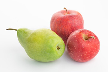 ripe green pears and red apples on a white background