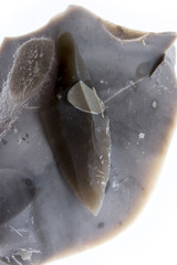  an arrowhead made from flintstone close up - experimental archeology