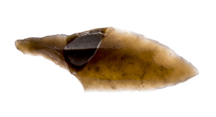  an arrowhead made from flintstone close up - experimental archeology