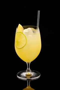 Delicious refreshing cocktail on a black background