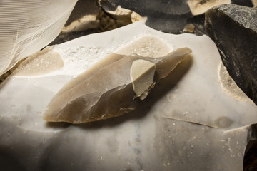  an arrowhead made from flintstone close up - experimental archeology