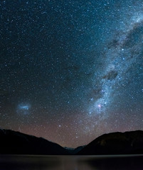 Amazing Starry night at Lake Rotoiti. Reflection of the Milky way and galaxy on the lake. Nelson Lake National Park, New Zealand.