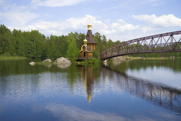 View of church of the apostle Andrew the First-Called on the Vuoksa River in the June solar...