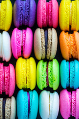 colorful macarons dessert with vintage pastel tones. Colorful french macarons background,Different colorful macaroons background.Tasty sweet color macaron,Bakery concept.Selective focus.