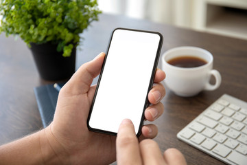 man hands holding phone with isolated screen in office