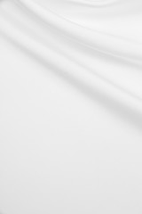 Obraz premium Smooth elegant white silk or satin luxury cloth texture as wedding background. Luxurious background design