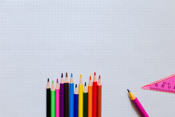 Color pencils and ruler on a sheet of paper