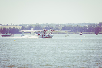 Obraz premium Flight Boat Consolidated PBY Catalina at Air Show Mazury 2018 event at the lake Niegocin in Gizycko. Poland.