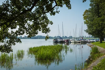 Fototapeten Große Seen Marina and pier on Rynskie lake, town of Ryn.  © Curioso.Photography