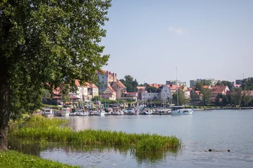 Gordijnen Marina and pier on Rynskie lake, town of Ryn. © Curioso.Photography