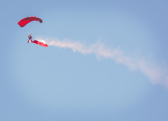 Parachutist with the Polish flag at Air Show Mazury 2018 event at the lake Niegocin in Gizycko. Poland.