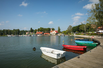 Naklejka na ściany i meble Marina and pier on Rynskie lake, town of Ryn.