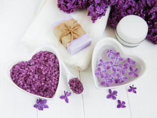 Spa towel and massage products with lilac flowers