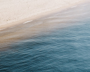 The beautiful calm view of blue sea and coastline.