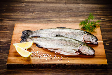 Fresh raw trouts on cutting board
