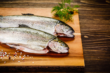 Fresh raw trouts on cutting board
