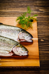 Fresh raw trouts on cutting board