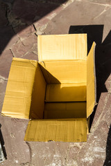 open cardboard box in beige color