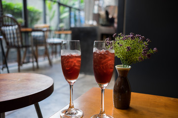Two glass of wine on the table.