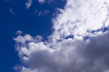 blue sky with white and gray clouds; cumulus. background; nature