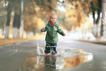 little girl on an autumn walk in the park