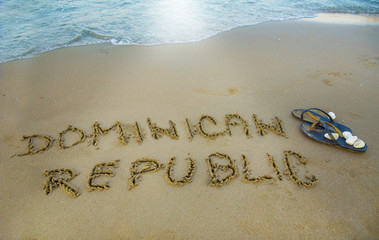 Dominican republic written in the sand. Exotic vacation concept