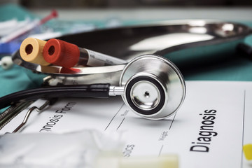Diagnostic form, Vial of blood samples and Medicine in a hospital, conceptual image