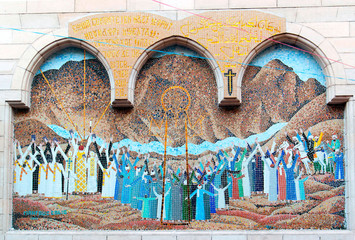 Cairo, Egypt February 18, 2017Mosaic representing Jesus Christ at the entrance of a small Coptic church with a wooden column porch in the Christian quarter of Cairo