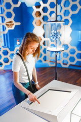 Girl student chemist studying the chemical compound molecule