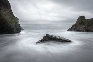 Waves around rock, Whipsiderry Beach, Porth, Newquay, Cornwall