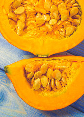 Pumpkins on rustic blue background. Autumn background.