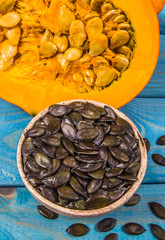 Pumpkins on rustic blue background. Autumn background.